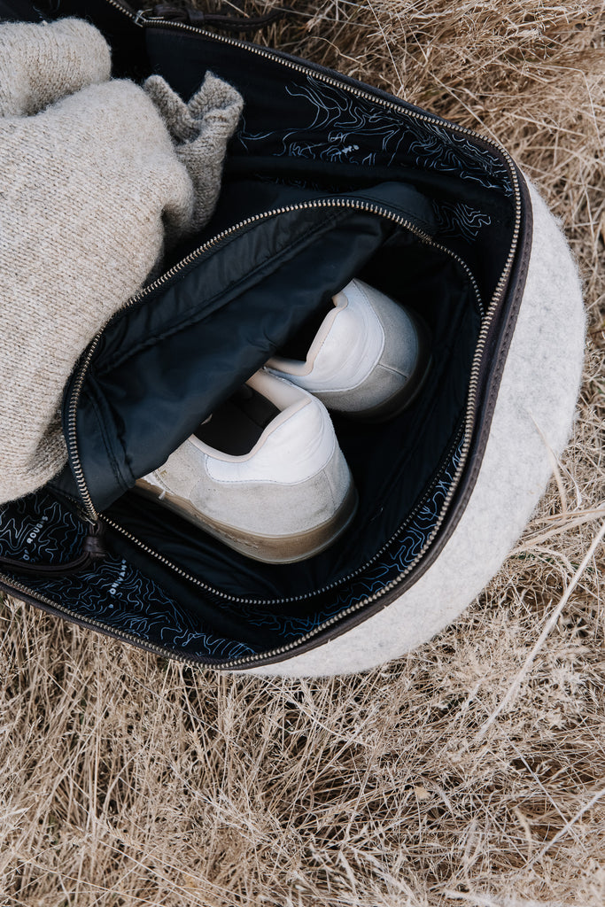 Honest wolf wool backpack in taupe with brown leather lifestyle