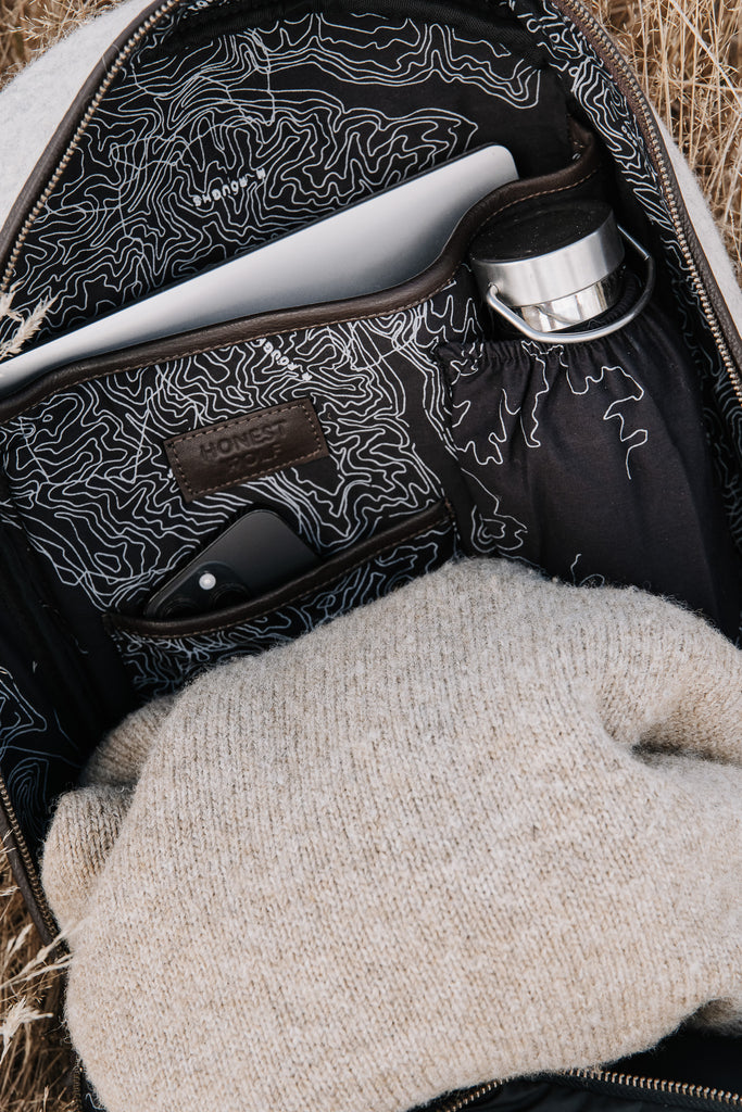 Honest wolf wool backpack in taupe with brown leather lifestyle