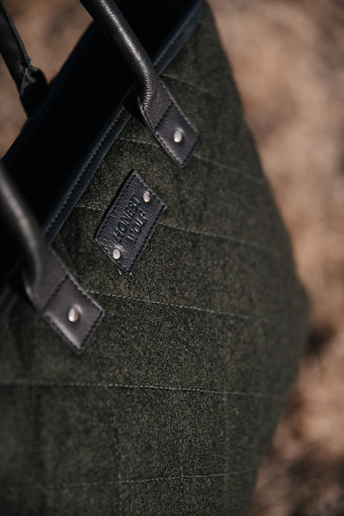 Honest wolf green quilted mini tote bag on farm lifetsyle