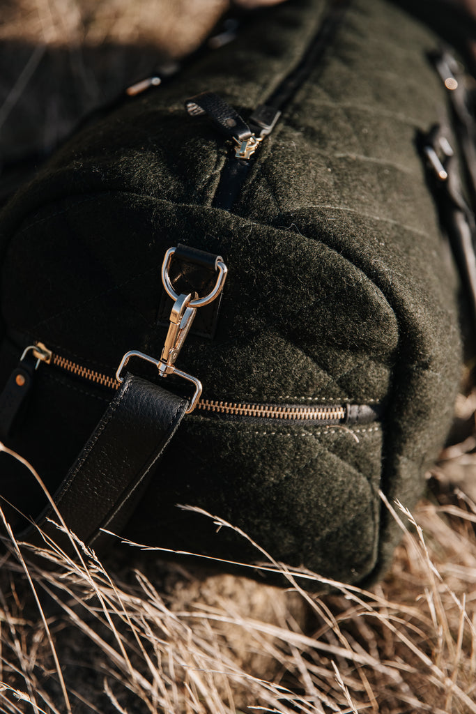 honest wolf green quilted weekender on farm lifestyle gold hardware