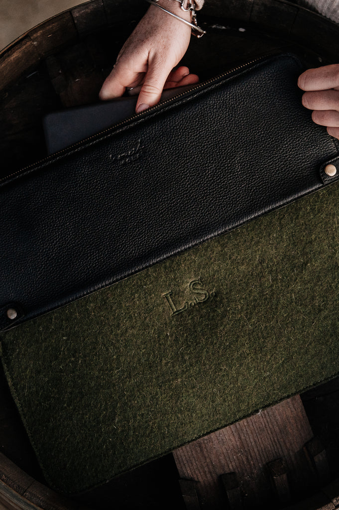 Honest wolf wool laptop sleeve forest green lifestyle embroidery