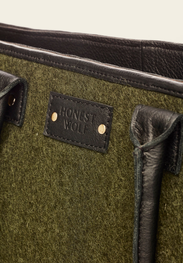 honest wolf forest green wool mini tote bag product view of the Honest Wolf logo