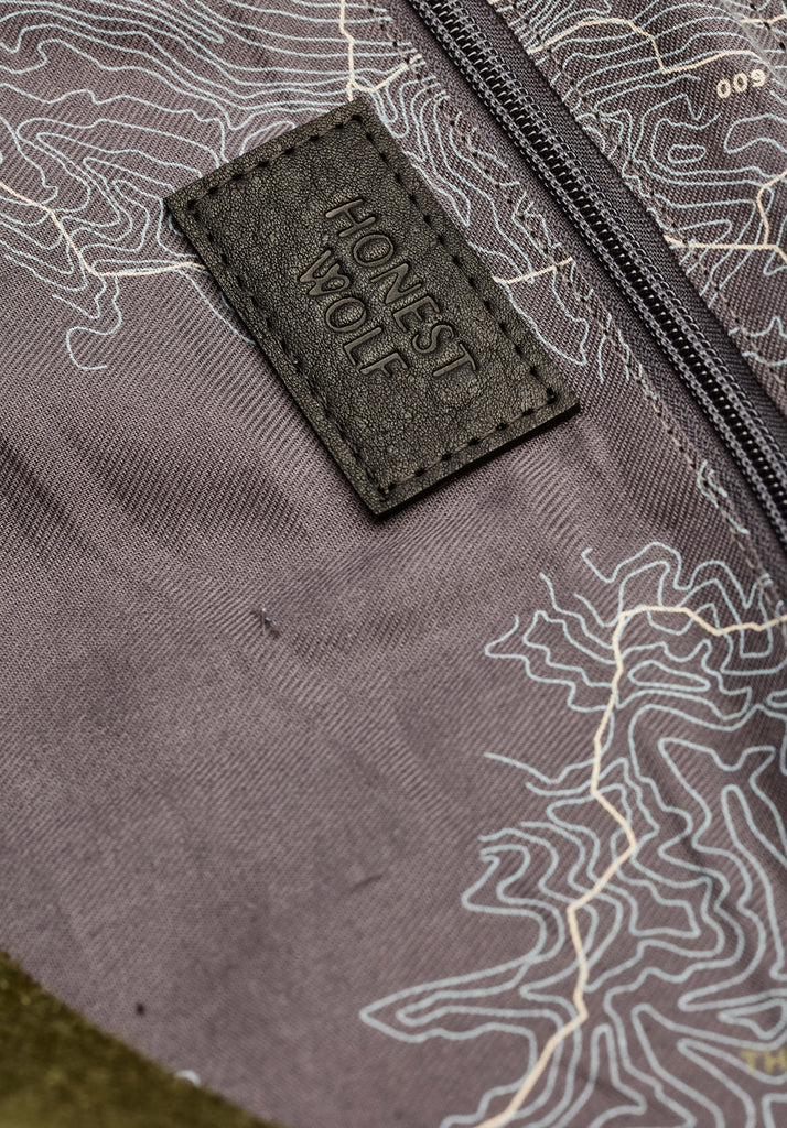 Honest wolf wool weekender travel bag forest green  logo detail product