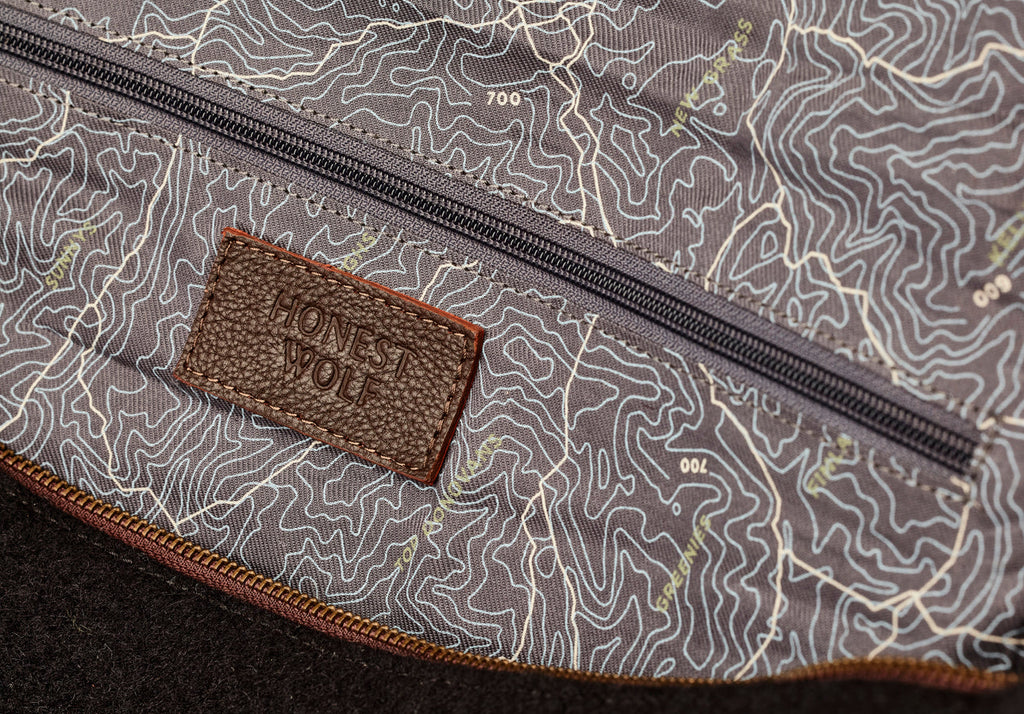 Honest Wolf The Weekender - Midnight Brown - inside view of lining, logo and pocket detail wool product