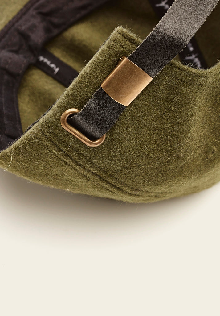 honest wolf The Wool Cap - Moss - close up view of finishing and strap detail product 