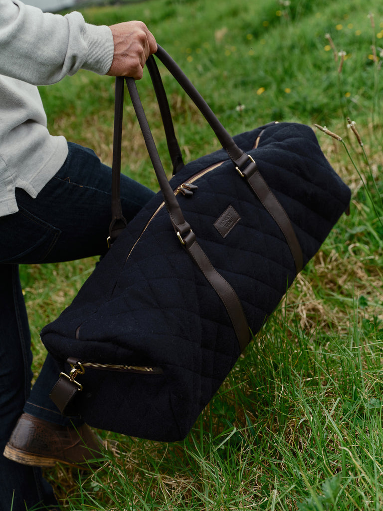 honest wolf wool navy quilted weekend bag lifestyle