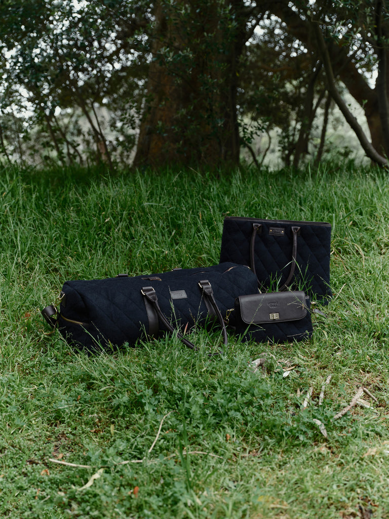 honest wolf wool navy quilted weekend bag lifestyle