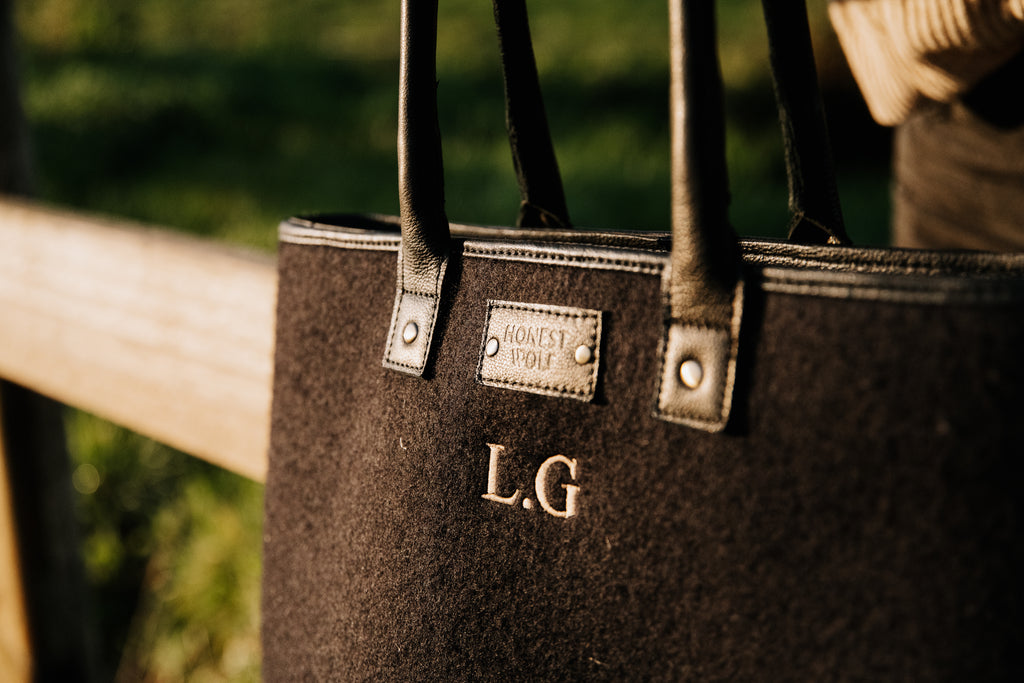 Honest Wolf wool mini tote bag in midnight black lifestyle embroidery