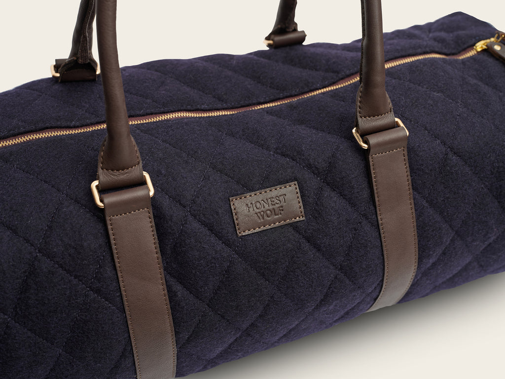 honest wolf wool navy quilted weekend bag  product