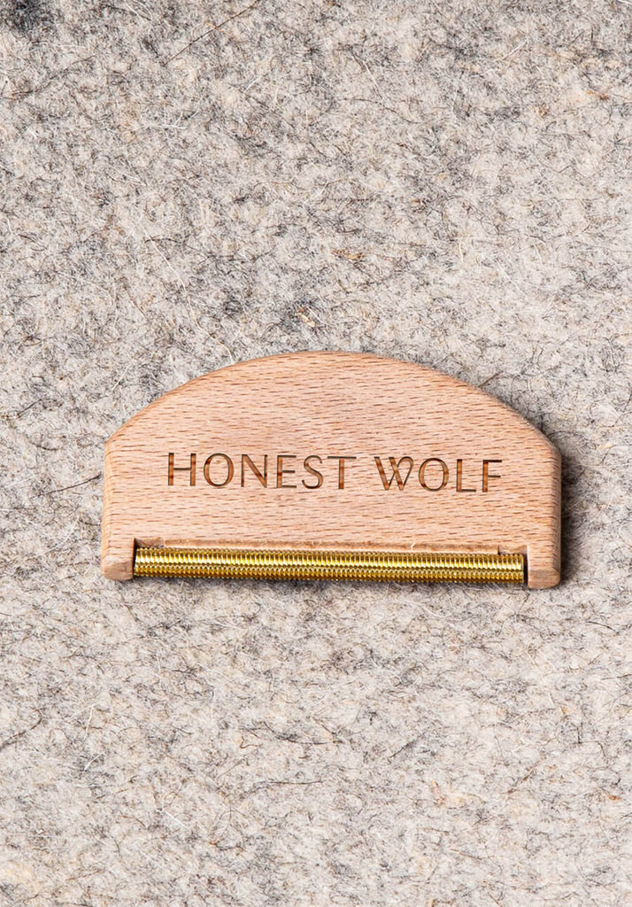 Honest Wolf - wool Comb displayed on a bag lifestyle