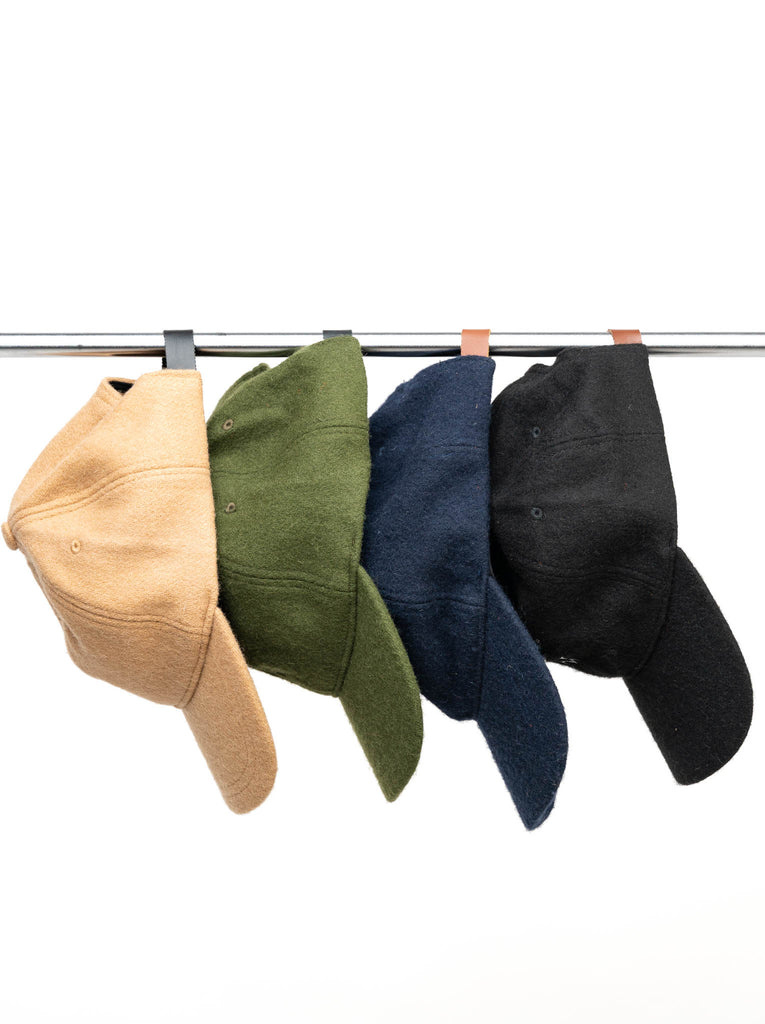 Heritage Wool Caps all colours hanging on a rack lifetsyle 