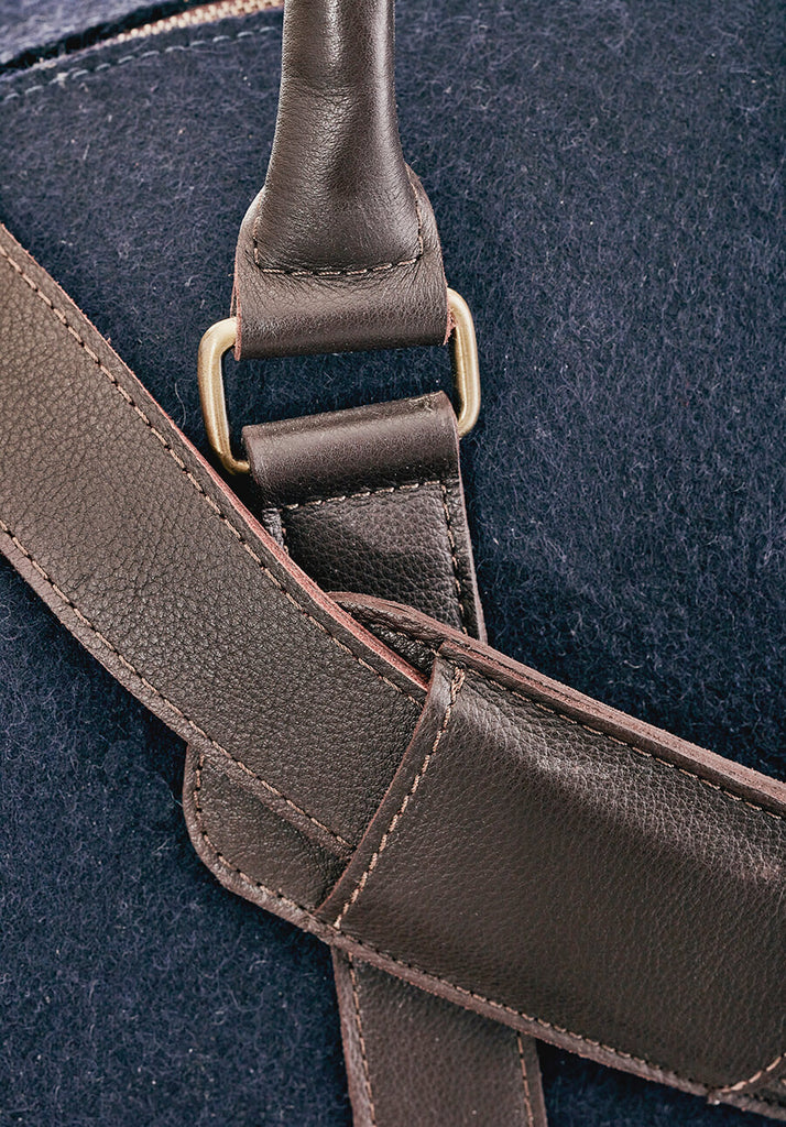 The Overnighter - closeup detail of strap finishes Honest wolf navy wool product
