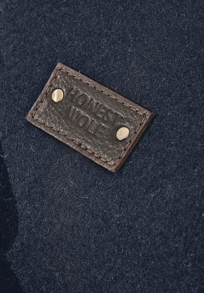 The Overnighter - close up detail of logo honest wolf wool product