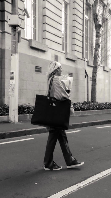 Add Embroidery - person walking with embroidered bag